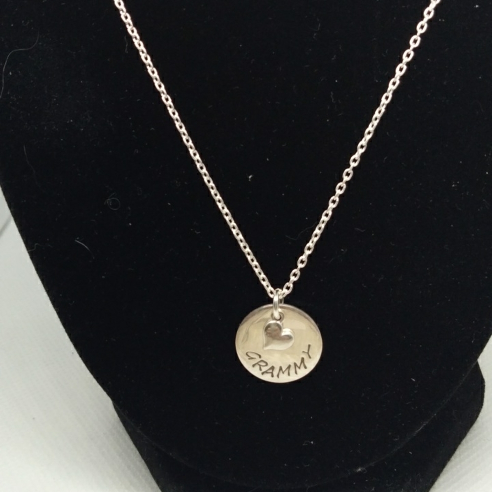 Sterling silver marked 925 on chain with Grammy pendant.